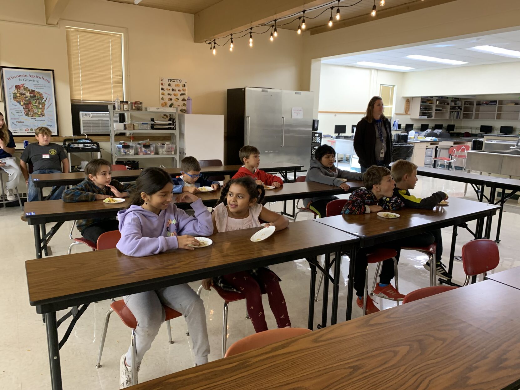 Students listen to a presentation on how different ingredients for tacos are produced